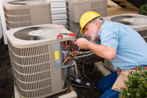 man fixing hvac