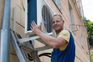 man repairing hvac