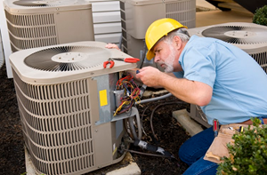 image of HVAC repair company working on air conditioner
