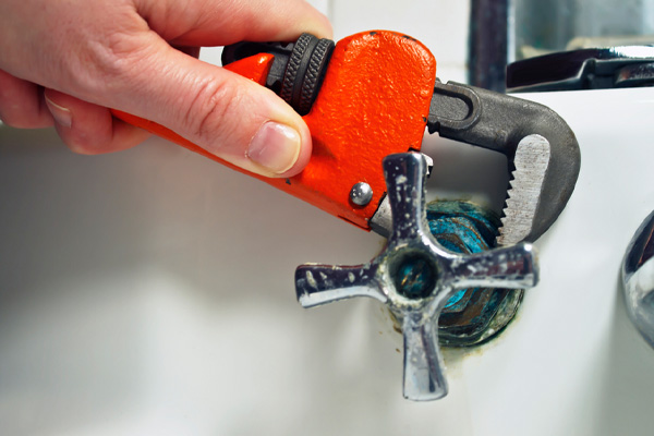 image of faucet handle removal during faucet repair
