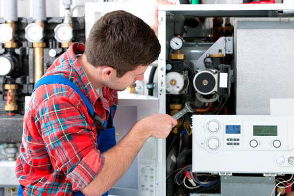 image of an hvac contractor performing a furnace repair