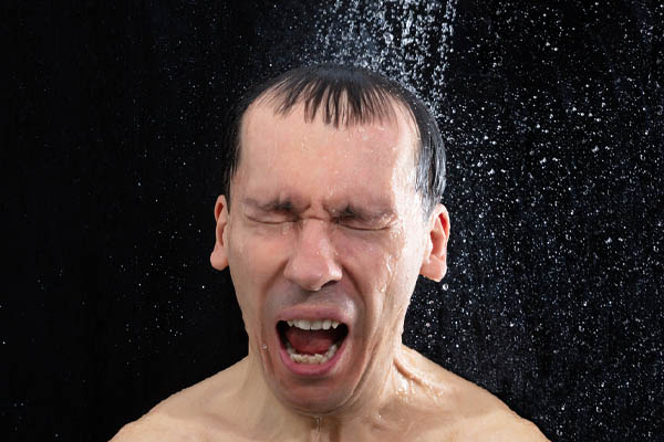 image of a homeowner running out of hot water in the shower