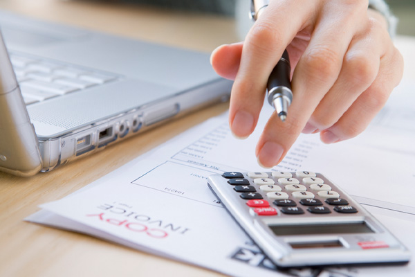 image of homeowner with calculator depicting hvac replacement costs