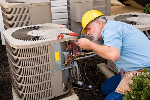 image of an hvac contractor performing air conditioner tune-up