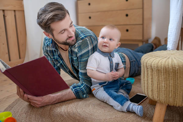 dad with boy depicting heating needs in winter and heating oil tank size