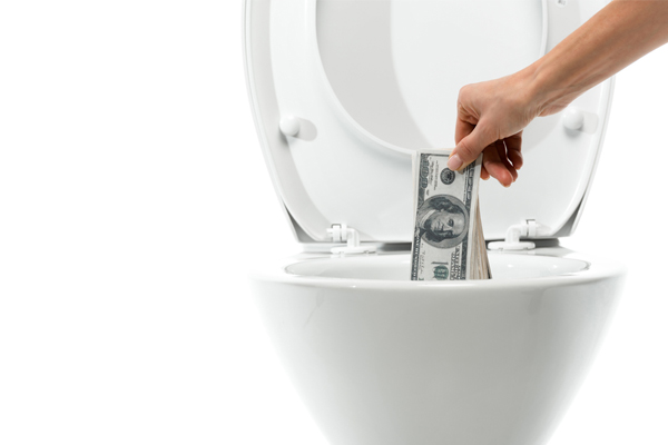 image of toilet with money due to toilet leak