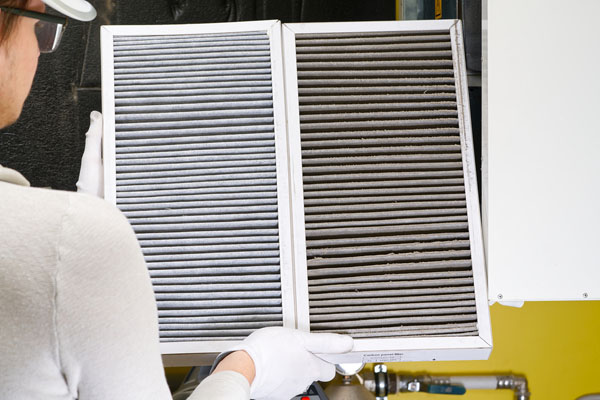 home air filter replacement new and old hvac filter next to eachother