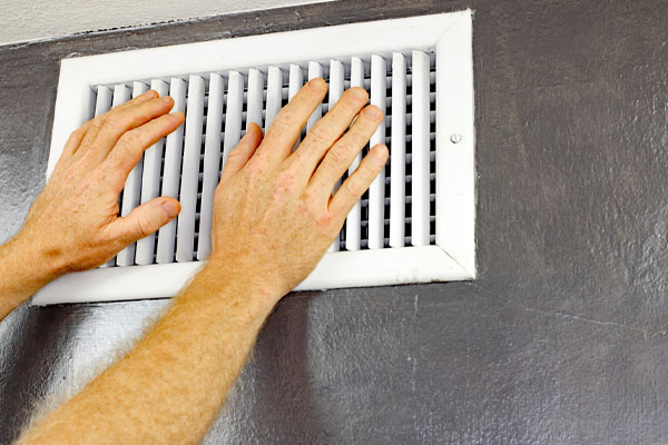 image of a hvac air vent depicting obstructed heat pump vent