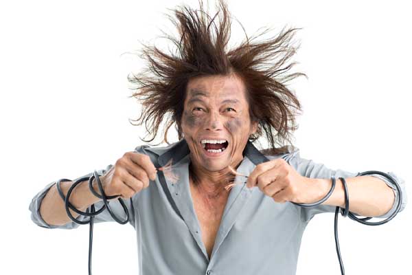 image of a homeowner dealing with electric shock from DIY air conditioner repair