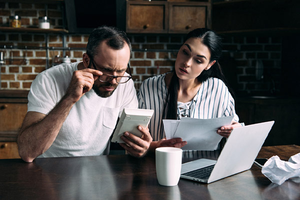 image of  a couple calculating bills and home heating