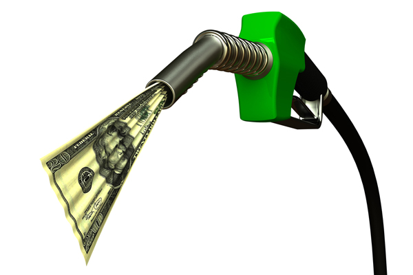 image of diesel pump and money depicting diesel gas fuel cost