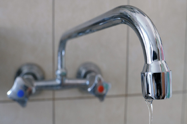 image of poor water pressure from faucet depicting water pressure issues