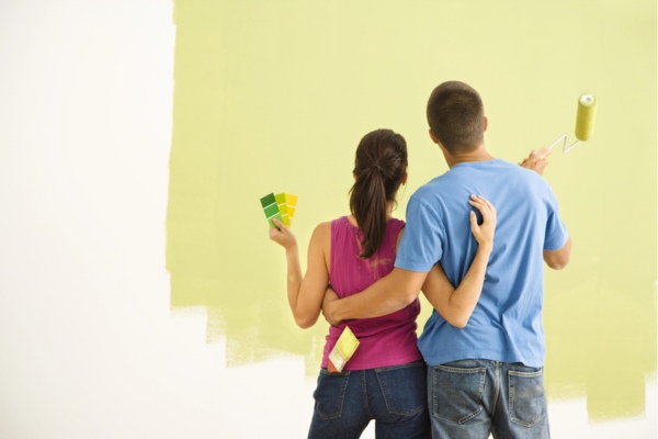 couple painting wall that can potentially release harmful gases in the air